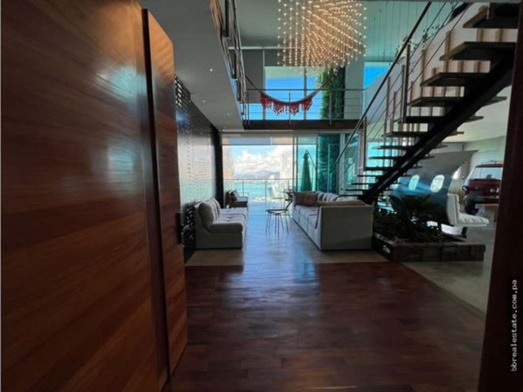Modern kitchen with granite countertops, large island and luxury appliances in penthouse Punta Pacifica Panama