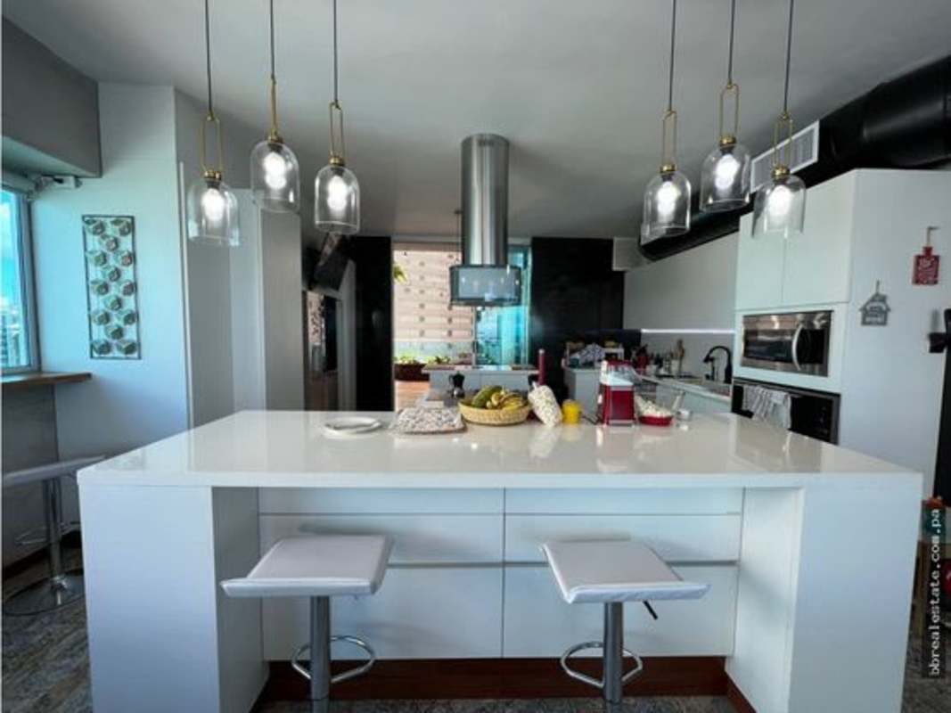 Panoramic terrace balcony with ocean and city skyline view in luxury penthouse for rent Punta Pacifica Panama