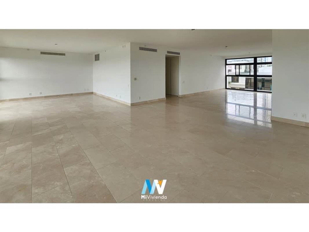 Double height modern lobby with concierge at PH Caleta Coco del Mar