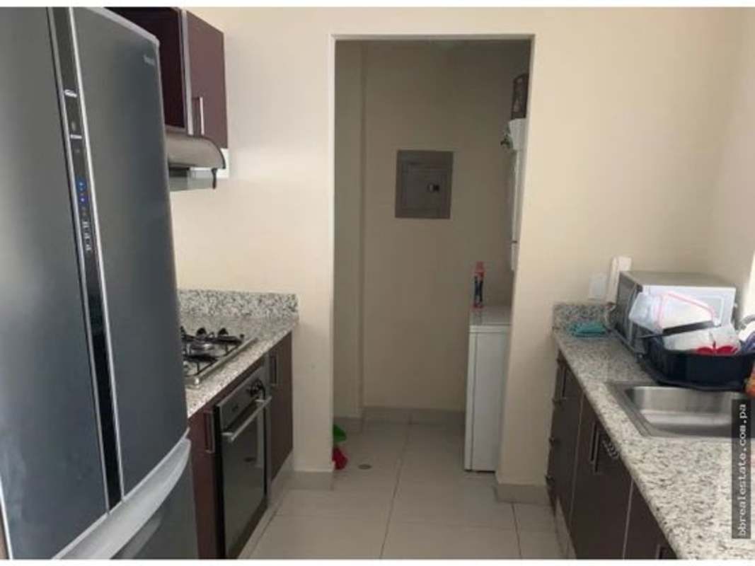 Open loft bedroom area with large windows, minimalist decor at PH Vitro Loft El Cangrejo Panama City