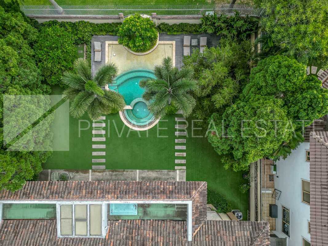 Gourmet kitchen with granite countertops, island, appliances in luxury mansion Costa del Este