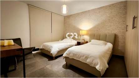 Open plan living dining space with large glass doors to terrace in PH Las Islas San Carlos Panama