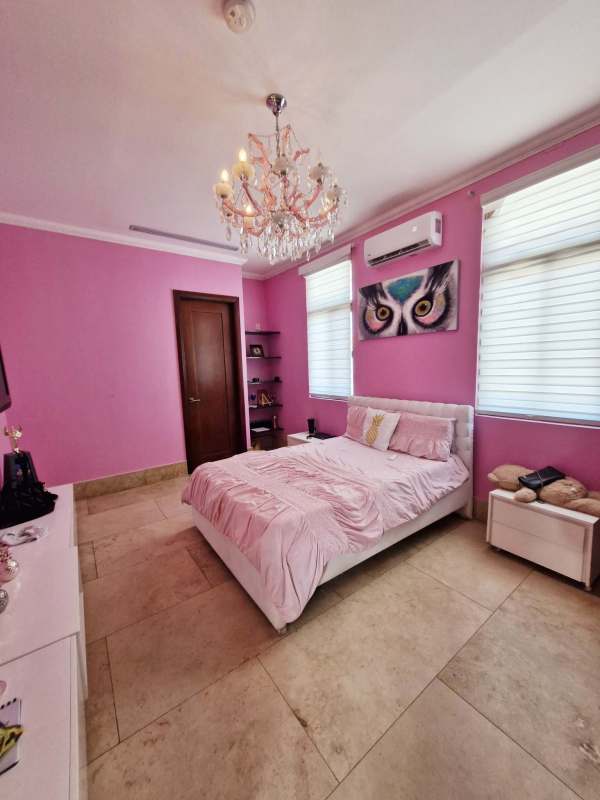 Covered terrace with lounge overlooking golf course Santa Maria Estate Panama