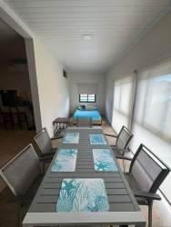 Wrap-around terrace on 2nd floor overlooking pool and tropical gardens at Cala Azul Costa Esmeralda