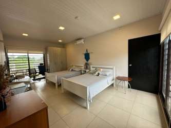 Bright living dining area open space with modern windows in Costa Esmeralda beach house