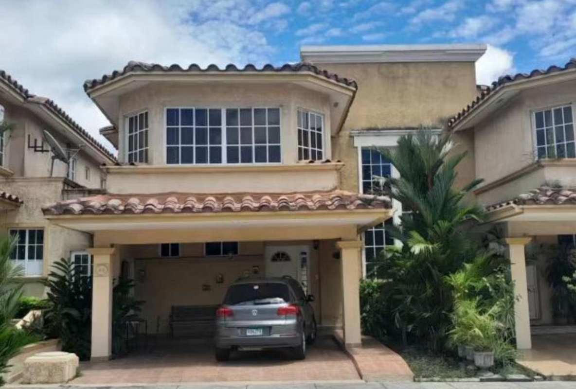 Two-story house with tile roof, bay windows, carport in Dorado Springs Condado del Rey Panama