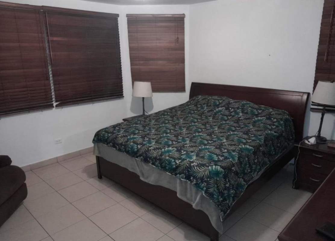 Bedroom with large window, contemporary furniture, AC in Dorado Springs Condado del Rey Panama