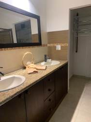 Private swimming pool surrounded by garden and covered terrace in Coronado Panama