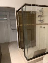 Spacious living room with large windows and garden views in Coronado beach villa Panama