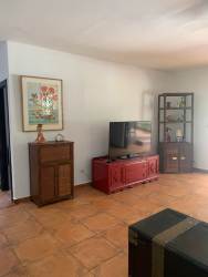 Bedroom with large window, bright space in renovated house Coronado Panama