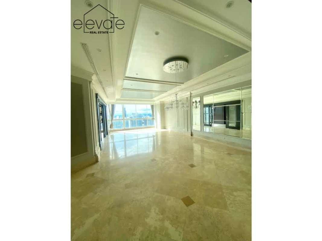 Spacious kitchen with wood cabinets granite countertops center island in PH Peninsula Panama City