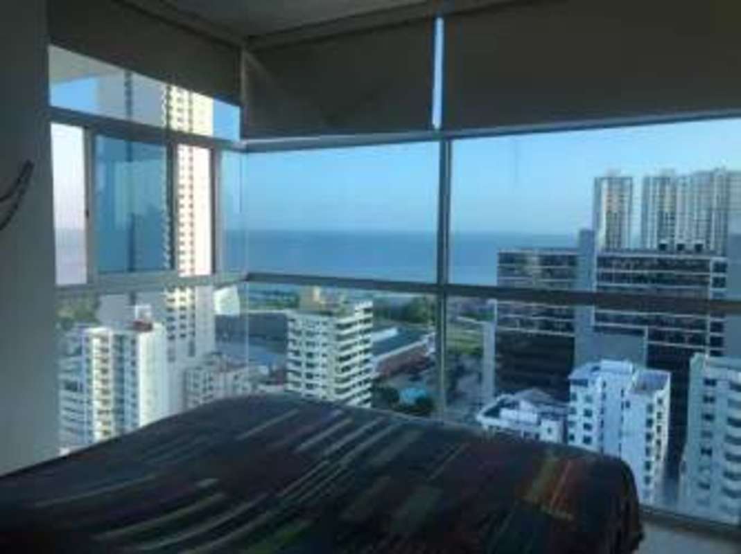 Spacious bedroom with large windows, skyline view PH Famagosta Loft