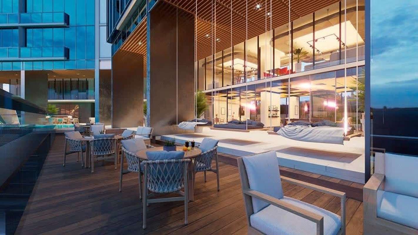 Outdoor cinema modern condo amenities rooftop lounge Generation Tower Panama real estate