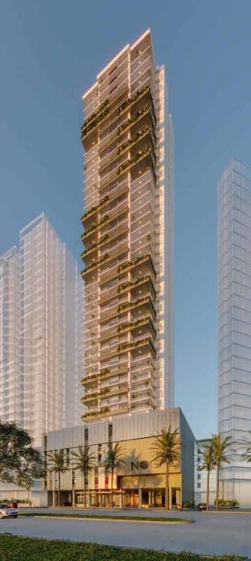 Tall luxury high-rise with balconies, glass walls, lighting accents and palm-lined entrance at Costa del Este