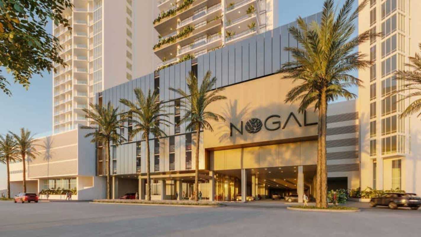 Modern pool with sun loungers and tropical landscaping at PH Nogal Panama