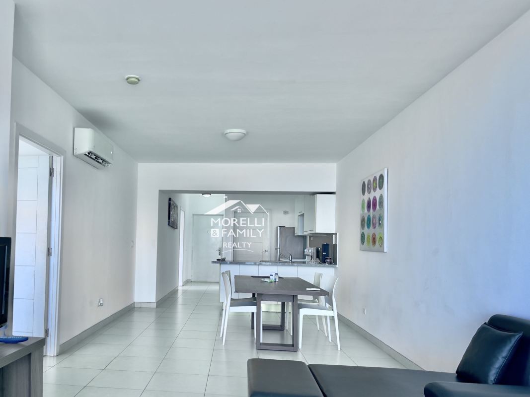 Open concept dining and living area with natural light, tile floors, ocean views PH BICSA Panama