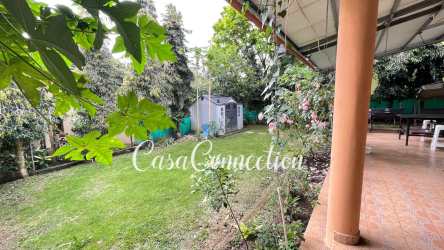 Large living and dining space with ceramic tiles and natural light in Algarrobos Dolega Panama