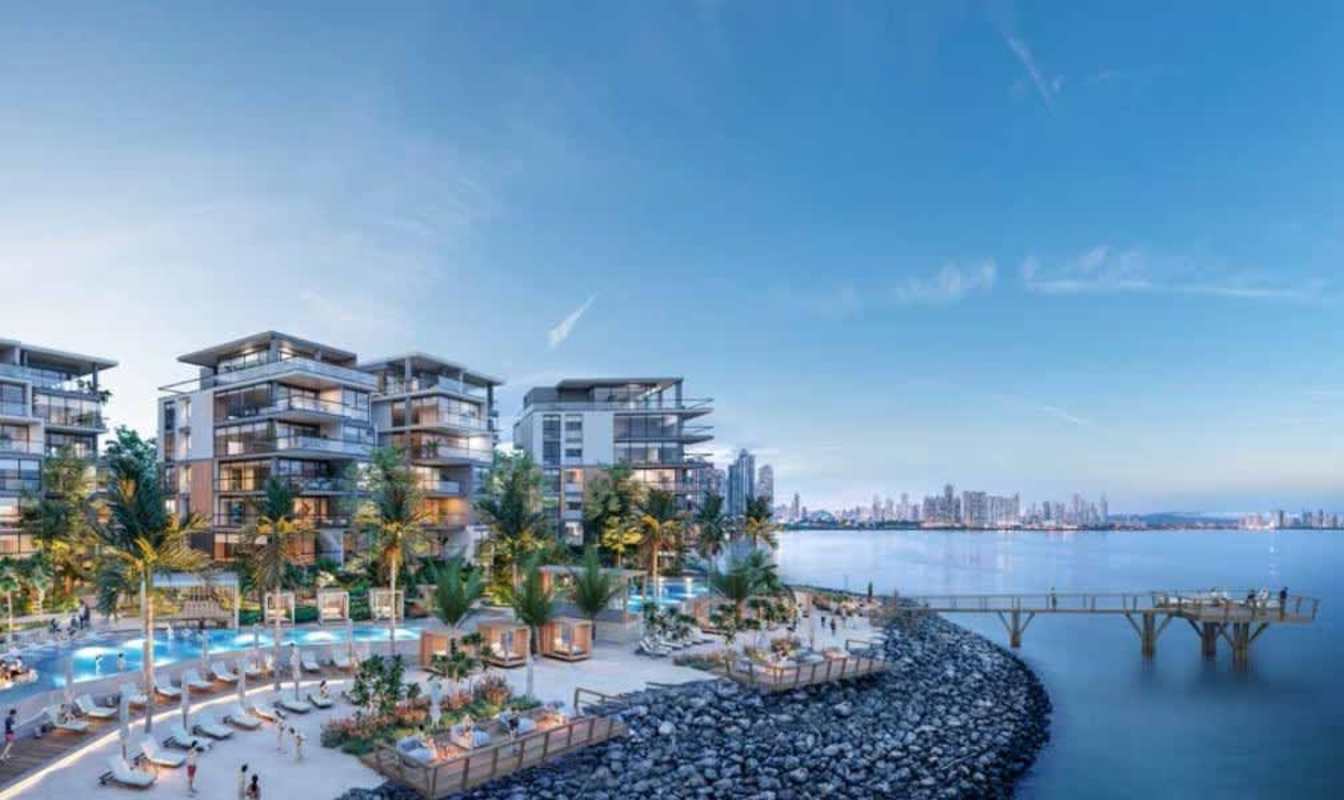 Modern beachfront residential towers, pool, cabanas, pier, city skyline in The Palms Ocean Reef Panama