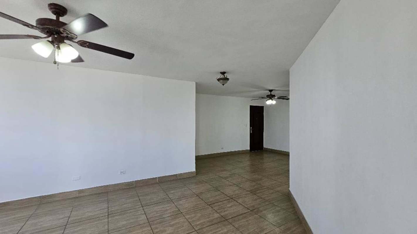 Kitchen with cabinetry, laundry area beside window at PH Brisas de San Fernando Panama City.