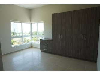 Modern bedroom in oceanfront Bijao condo with large windows Sherman 2