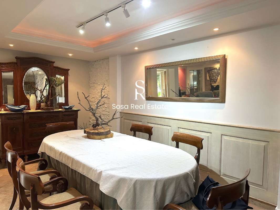 Kitchen with granite countertops, stainless appliances and wood cabinetry in luxury Panama home