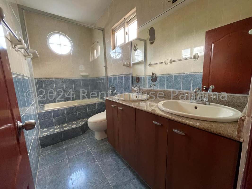 Spacious master bedroom with private balcony and ensuite bath in PH Rainforest Villas Altos de Panamá, Panama City