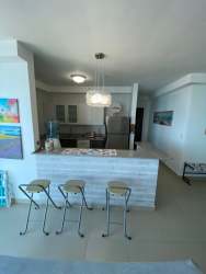 Private balcony with glass railing overlooking Pacific Ocean Playa Corona apartment