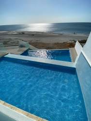 Open living dining area with ocean view windows Corona Beach Residences in Playa Corona Panama