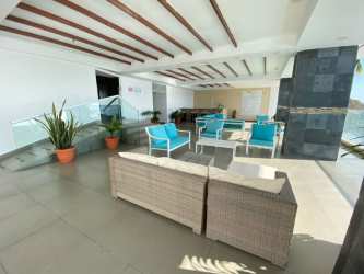 Infinity pool overlooking sand beach and Pacific Ocean at Corona Beach Residences Playa Corona Panama