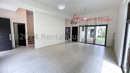 Contemporary living room with large windows and tile floors PH Nativa Panama Pacifico