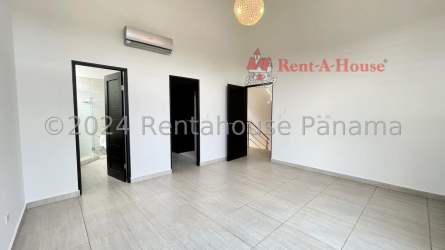 Double-height modern living room with staircase tile floors Panama Pacifico