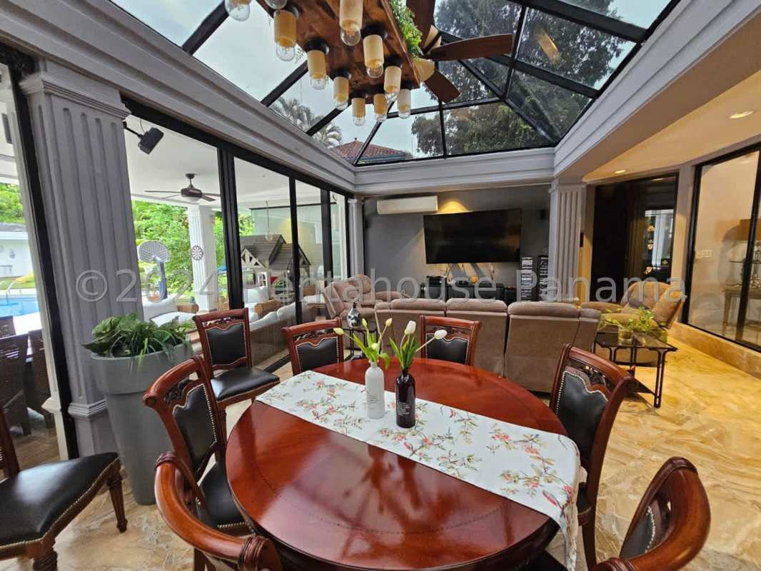 Elegant gated entrance with lush gardens Altos del Golf house Panama City