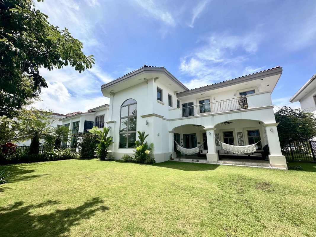 Spacious living room with double-height ceilings, large windows, marble flooring Santa Maria Panama