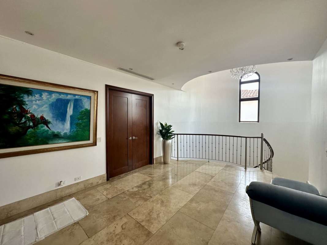 Elegant dining room with velvet chairs, chandelier and garden views Santa Maria Panama