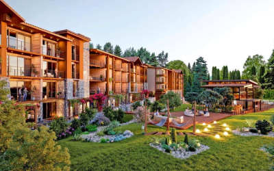 Wooden multi-story condominium with landscaped gardens and outdoor seating at Pinoalto Boquete