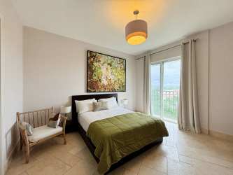 Bedroom with large window, balcony access, and natural light in Puntarena Buenaventura Panama