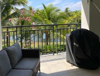 Dining area with modern furnishings, ceiling fan, terrace access in Laguna Buenaventura Panama