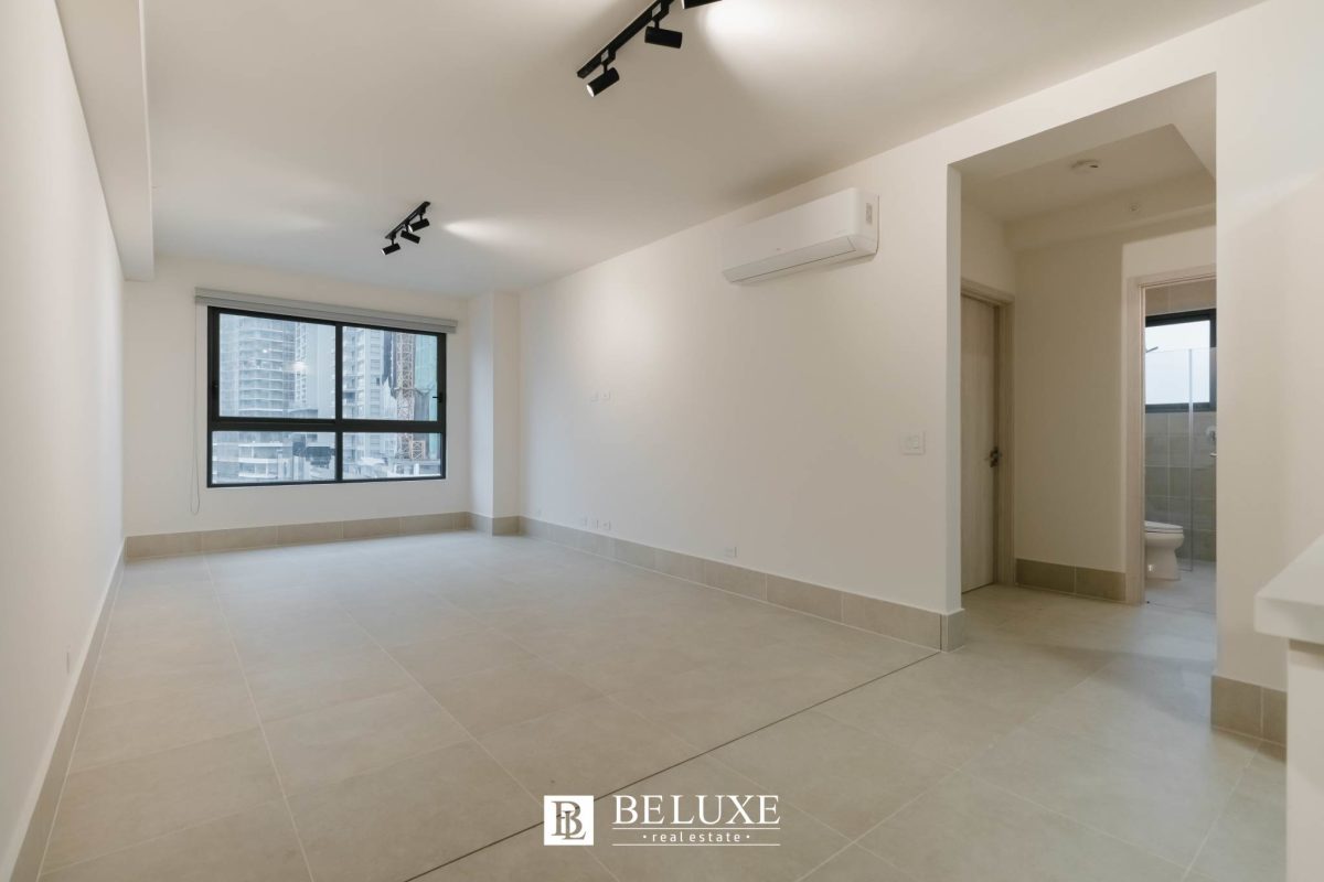 Modern living room with large windows, city skyline views, porcelain floors in PH Ocean House Santa Maria Panama