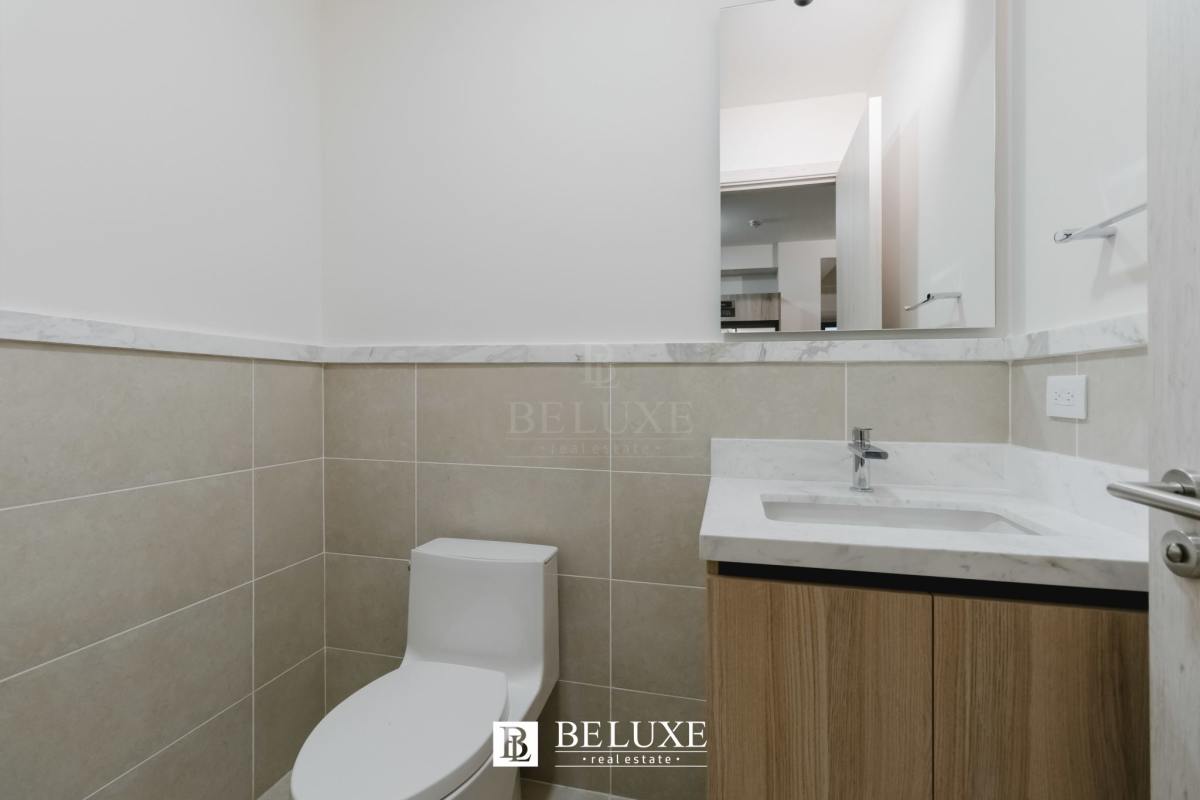 Elegant bathroom with marble vanity, porcelain tiles at PH Ocean House Santa Maria Panama