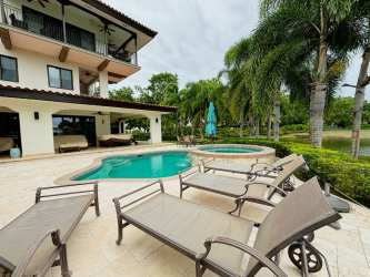 Mediterranean tropical villa exterior with pool, hot tub, patio and palm trees in Buenaventura Panama