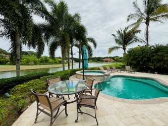 Lush backyard with pool, hot tub, patio seating and tropical landscape in Buenaventura Panama