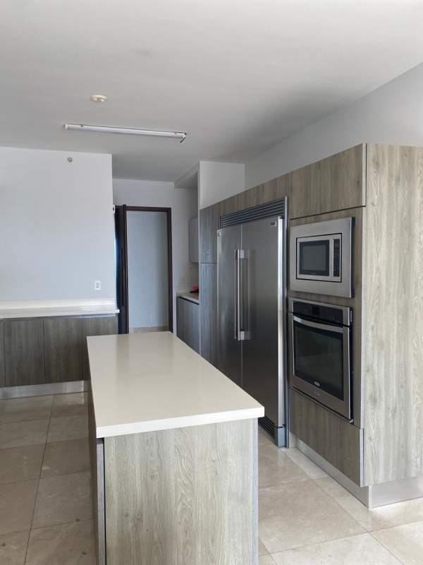 Modern kitchen with quartz island, built-in stainless steel appliances PH GreenGarden Costa del Este Panama