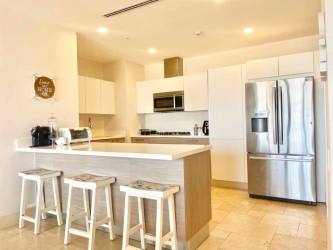 Spacious kitchen with island seating, stainless steel appliances and elegant design in Puntarena Buenaventura