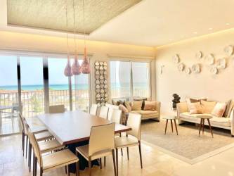 Modern living room with large windows offering ocean and marina view in Buenaventura Panama