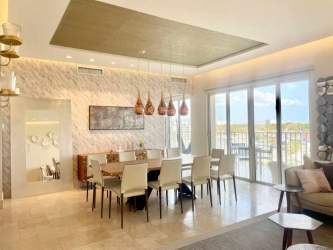 Dining area with large glass doors, elegant decor and balcony access in Puntarena Buenaventura