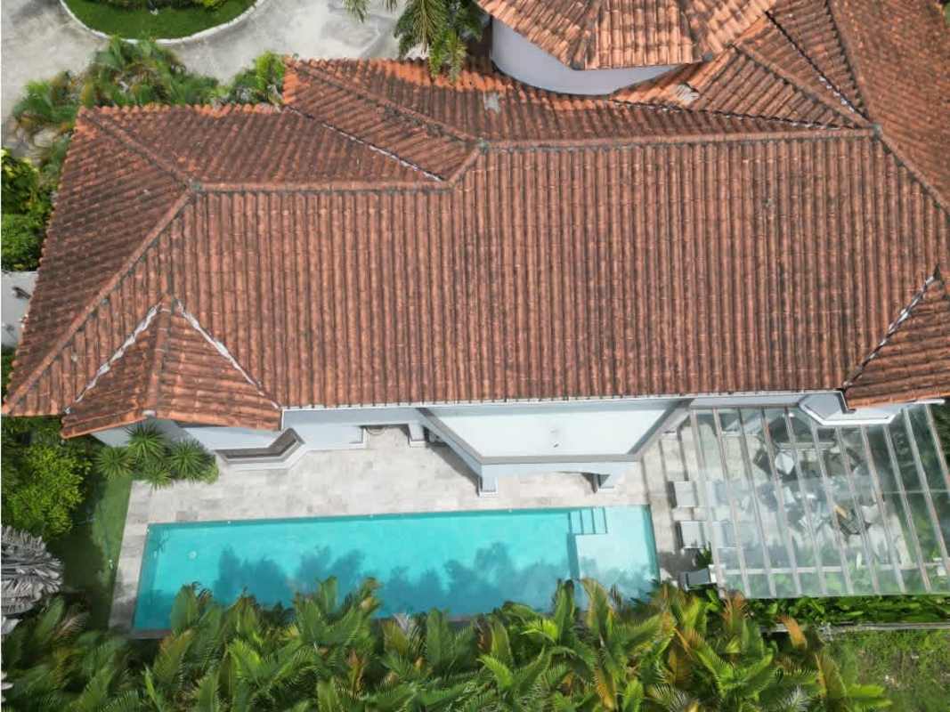 Spacious modern kitchen with granite island, stainless appliances light wood cabinetry in Costa del Este luxury home Panama