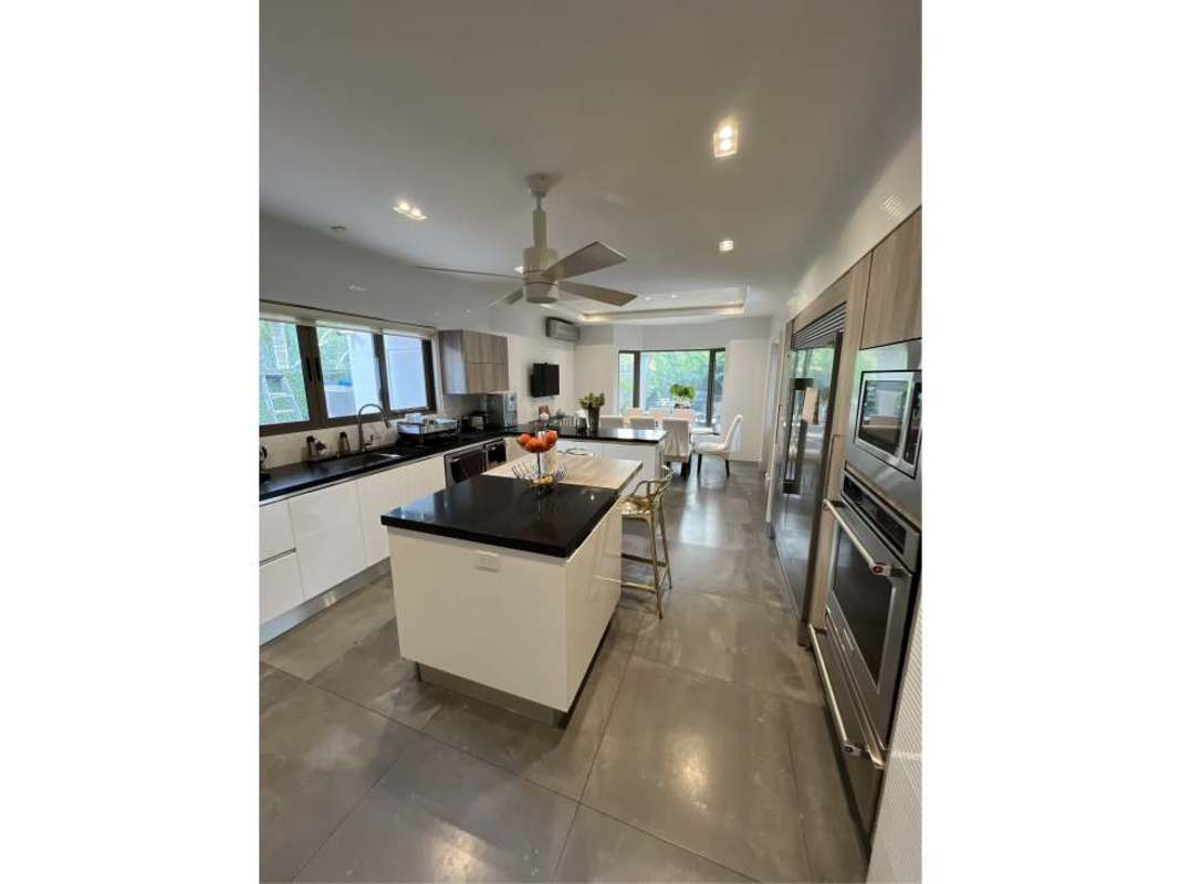 Modern kitchen featuring large island, stainless steel appliances, built-in ovens Costa del Este Panama