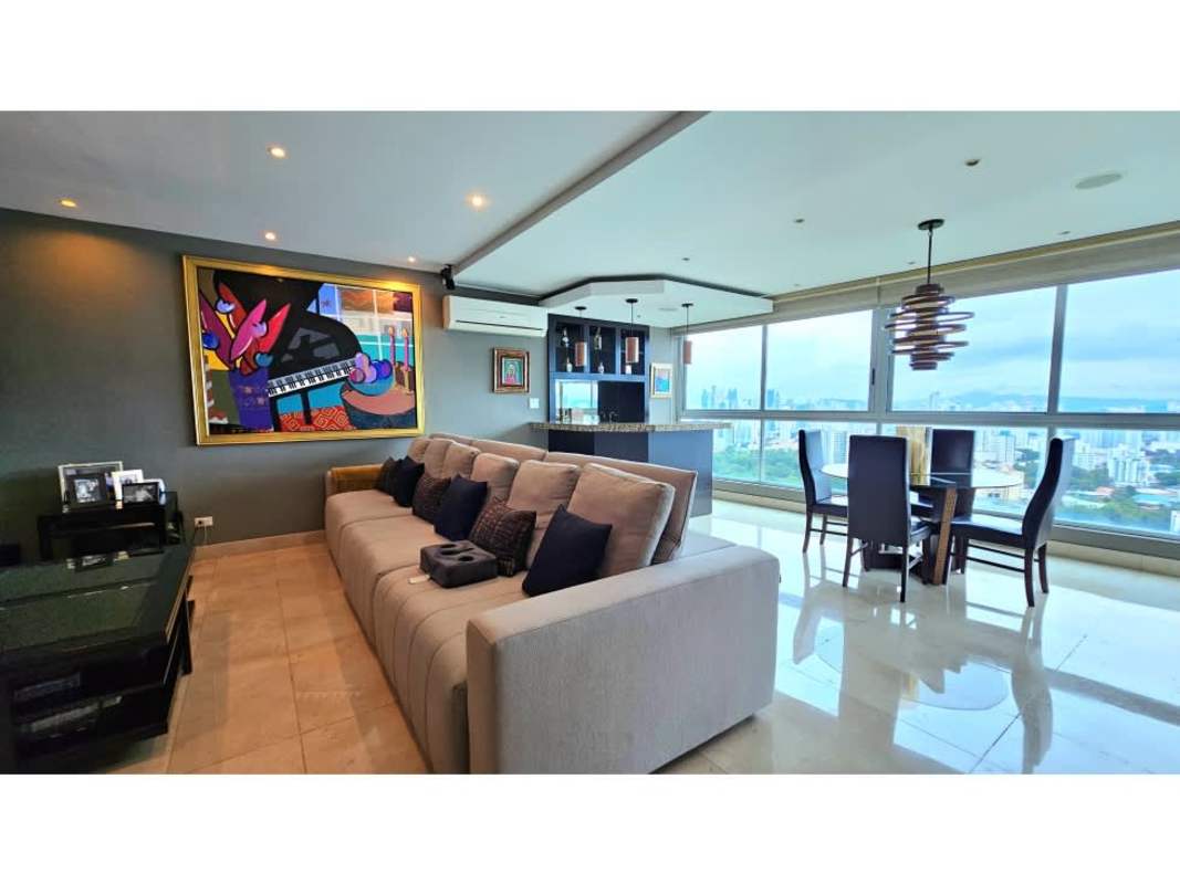 Elegant formal dining with panoramic windows overlooking Panama City at PH Arboleda