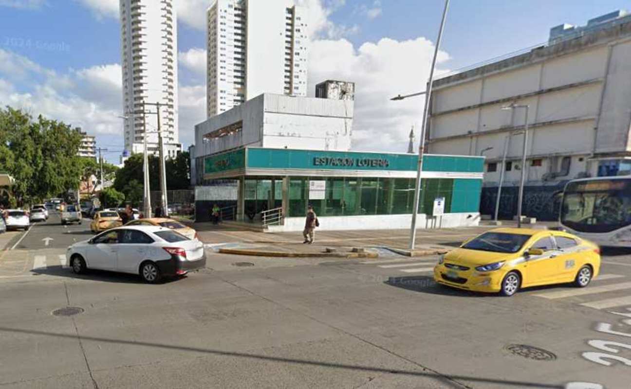 Unfinished commercial building facade with parking beside metro station Bella Vista Panama