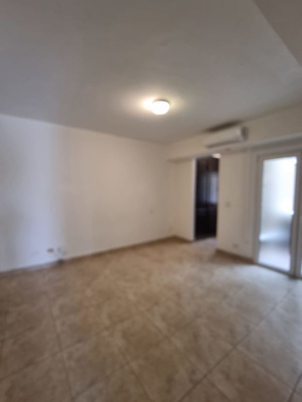 Traditional kitchen with granite counters, dark cabinets, and stainless appliances in Tucan Country Club condo